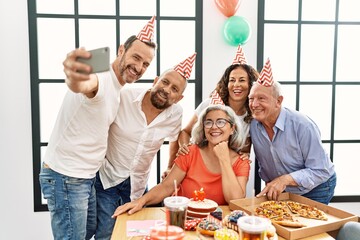 Poster - Group of middle age friends celebrate birthday make selfie by the smartphone at home.