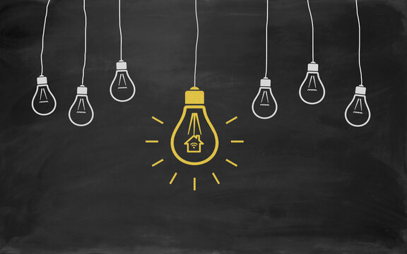 Smart Home Symbol Bulb Concept Drawing with Chalk on Blackboard