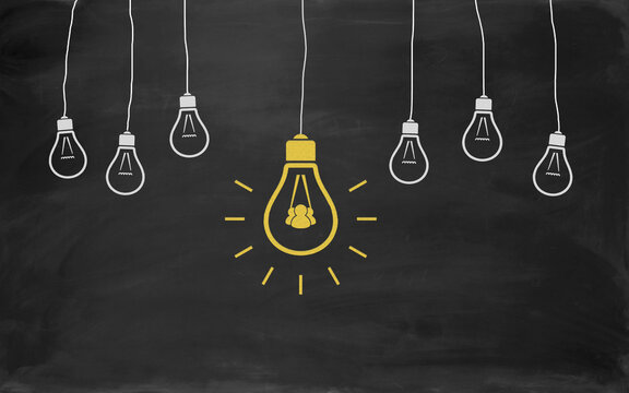 Social Media Symbol Bulb Concept Drawing with Chalk on Blackboard