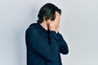 © Krakenimages.com - Middle age caucasian man wearing casual sweatshirt with sad expression covering face with hands while crying. depression concept.