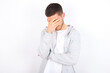 young caucasian man wearing casual clothes over white background making facepalm gesture while smiling amazed with stupid situation.