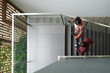 © DragonImages - Business colleagues with take out coffee walking up the stairs and discussing news, view from above