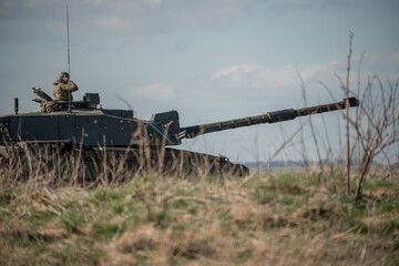 British army FV4034 Challenger 2 main battle tank with the commander directing action on a military exercise, Wiltshire UK