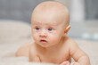 © andrey - Funny and beautiful baby on the bed. children's health.