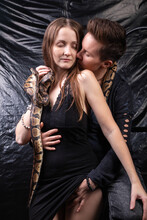 Photo Of Two Kissing Lesbian Women With Snakes