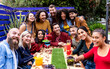 © Xavier Lorenzo - United international group of young friends having fun drinking cocktails in pub terrace - Friendship, unity and multiracial people concept