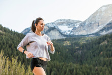 United States, Utah, American Fork, Athlete Woman Jogging In Mountain Landscape