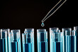 © Tetra Images - Pipette dropping liquid into test tube