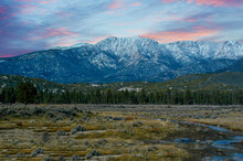 Early Morning Sunrise Over The San Gabriel Mountains With Fresh Dusting Of Snow From A Storm The Night Before. 