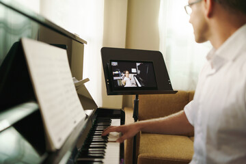 scene of piano lessons online training or e-class learning while coronavirus spread out or covid-19 