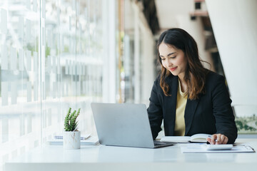 Aufkleber - Happy young indian business woman entrepreneur using computer looking at screen working in internet sit at office desk, smiling hindu female professional employee typing email on laptop at workplace