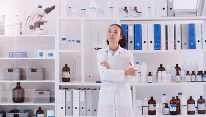 Wall Mural - i hope my findings lead to something great. shot of a young scientist looking at the notes written o