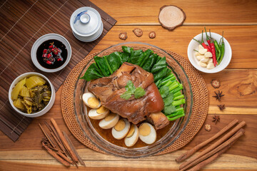 Wall Mural - Asian food, Stewed Pork Leg Recipes and egg with five spices  served with blanched kale, black soy sauce, garlic and  fresh chili.