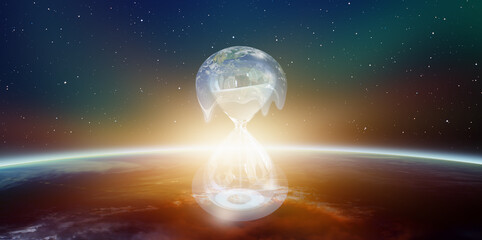 Poster - Global warming concept - Planet Earth on hourglass is slowly melting -Hourglass inside glass globe (earth) isolated on black background 