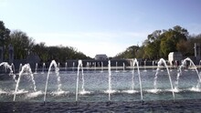 Dolly Motion World War II Memorial Fountain Full Of Tourists And Lincoln Memorial As Background, Washington