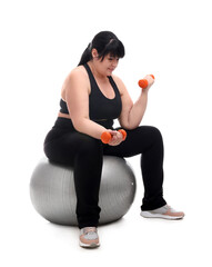 Sticker - Happy overweight mature woman with dumbbells sitting on fitness ball against white background