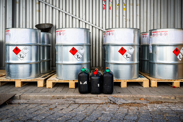 big metal barrels containing hazardous chemicals from laboratories, waste management concept, indust