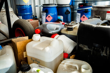 metal and plastic barrels containing hazardous chemicals from industry, waste management concept, bu