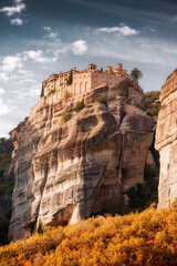 Wall Mural - Monastery of Varlaam on top of a sandstone pillar cliff. The miracle of Meteora - harmony of mankind and nature in Greece. Very famous and iconic travel and pilgrimage destination