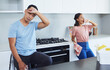 © Siphosethu F/peopleimages.com - Cleaning the house is exhausting. Shot of a young couple taking a break from cleaning their kitchen.