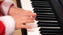 Anonymous Elementary School Age Child Playing The Piano, Hands, Fingers Moving On The Keyboard, Keys Detail, Closeup, Slow Motion. Children And Musical Instruments, Talent, Hobby, Performance Concept