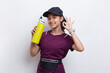 © dwi - Young beautiful asian sport woman drinking water after workout on white background