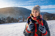 Happy girl in winter clothes portrait snowy outdoor during sunny day