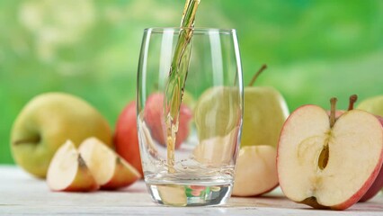 Wall Mural - Super Slow Motion Shot of Fresh Apple Juice Being Poured in a Glass at 1000fps. Filmed on High Speed Cinematic Camera.