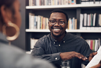 Poster - Our next project is going to be big. Cropped shot of a handsome young male architect having a discussion with his colleague in a modern office.