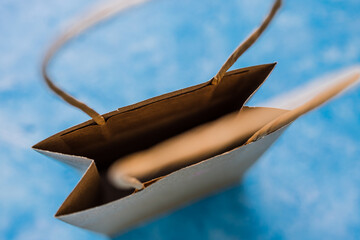 Wall Mural - paper shopping bag shot from top down perspective at extremely shallow depth of field