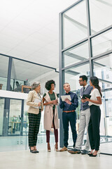 Poster - Business is built on a solid foundation of relationships. Shot of a group of colleagues having an informal meeting in an office.
