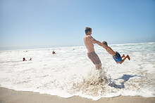Hanging Out At The Beach. Shot Of A Father And His Son Having Fun At The Beach.