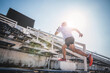 Athlete jogging stair jogging fitness male jogging jogging concept health. man running up the stair. Man running up the stairs of a building. Athlete climbing stairs as part of his physical training.