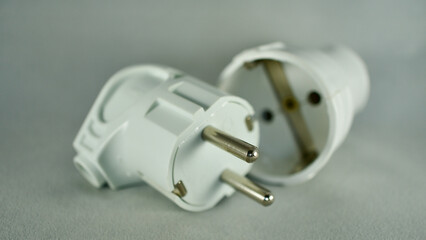 male and female power plug. Wireless plug end. Grounded plug.