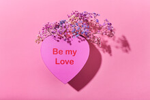 Heart-shaped Box And Flowers On Pink Background