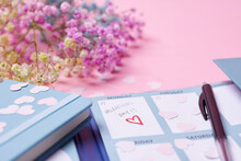 Heart-shaped Confetti And Calendar On Pink Background