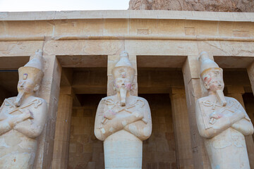 Wall Mural - The Hatshepsut statues by the columns on the highest terrace of the Mortuary Temple of Hatshepsut, Luxor, Egypt