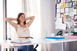 © Yuri A/peopleimages.com - Basking in the glow of success. A gorgeous young designer sitting at her desk in the office.