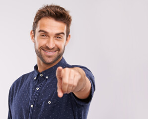 Poster - Hes made his choice. A handsome young casually dress man pointing straight at the camera.