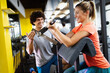 © NDABCREATIVITY - Portrait of happy fit people, friends exercising in gym together. Sport people workout concept