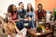 Group of friends bonding and having fun in a streaming live podcast, multiracial college students using the web and new technology to produce fresh contents, five social media influencer meeting