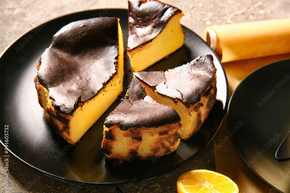 Tasty Basque burnt cheesecake on grunge background