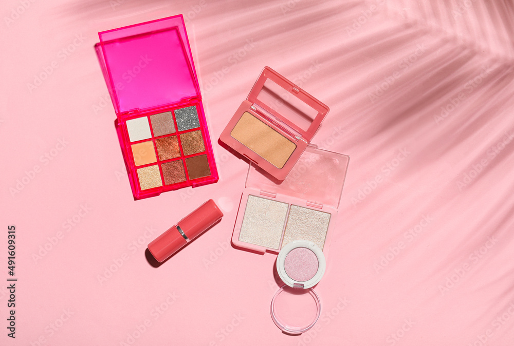 Cosmetic products on pink background