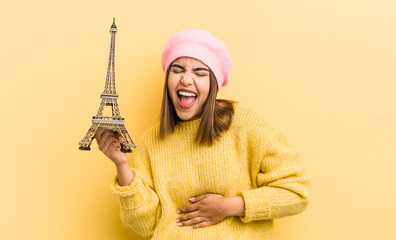 Wall Mural - pretty hispanic girl laughing out loud at some hilarious joke. paris concept