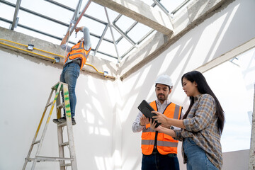 Poster - Engineer team work planning in construction site,Construction Contractors building a new home.