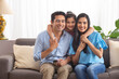 © IndiaPix - Happy couple with their little daughter at Home
