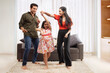 © IndiaPix - Parent and daughter dancing  together in living room