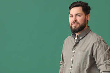 Wall Mural - Stylish bearded man on green background