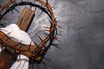 Wall Mural - Crown of thorns with wooden cross and shroud on dark background