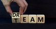 © Dzmitry - Dream team dreamteam symbol. Businessman turns wooden cubes and changes the word Dream to Team. Beautiful grey table grey background. Business and dream team dreamteam concept, copy space.